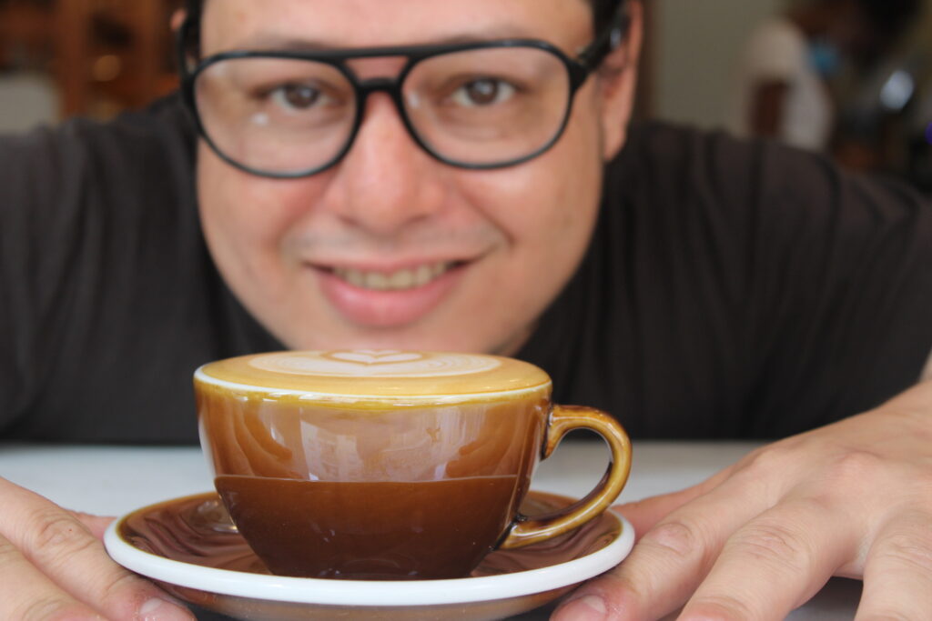 Jesus Martinez with latte art coffee